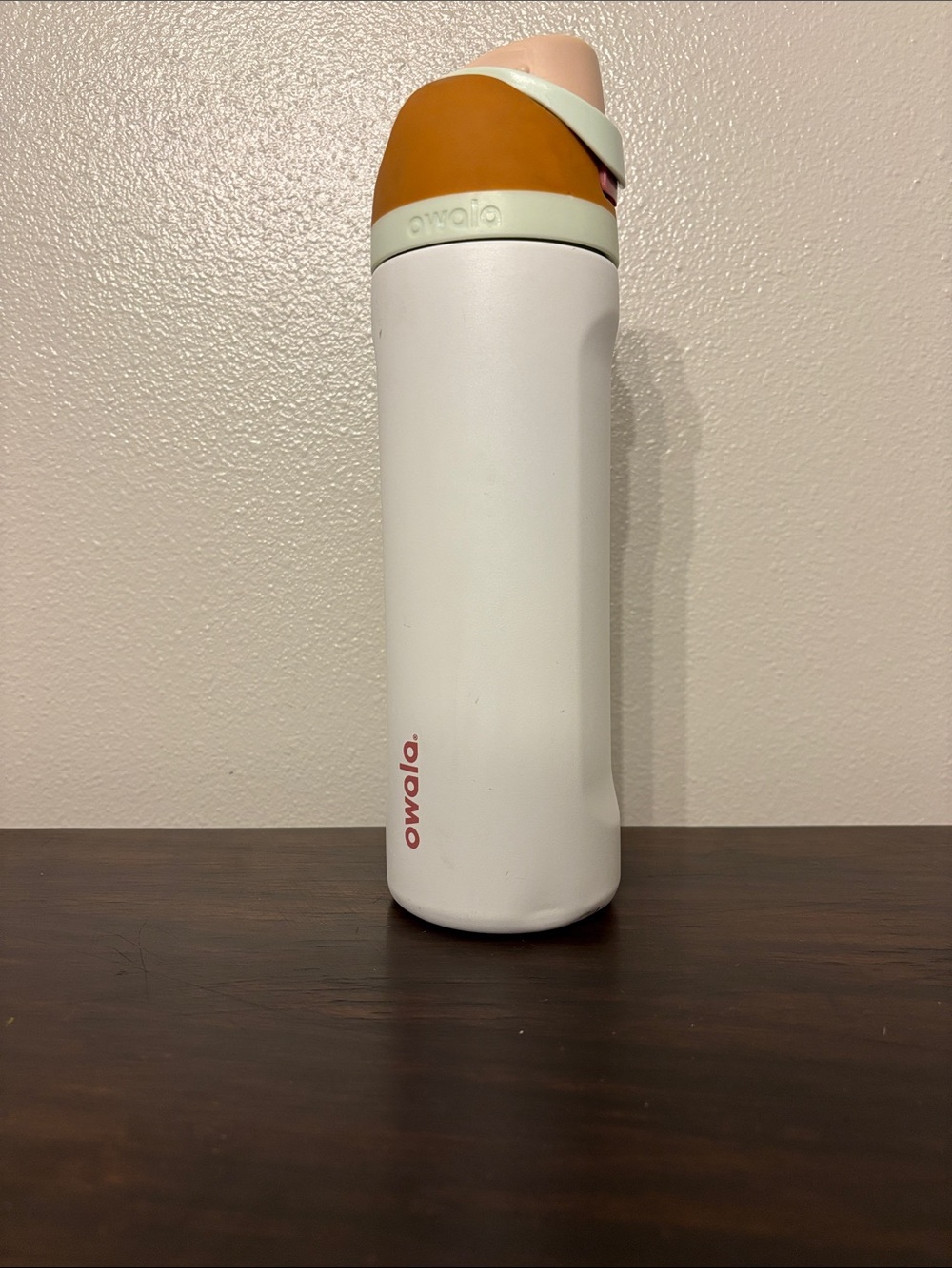 Owala White Water Bottle with Mustard and Blush Lid